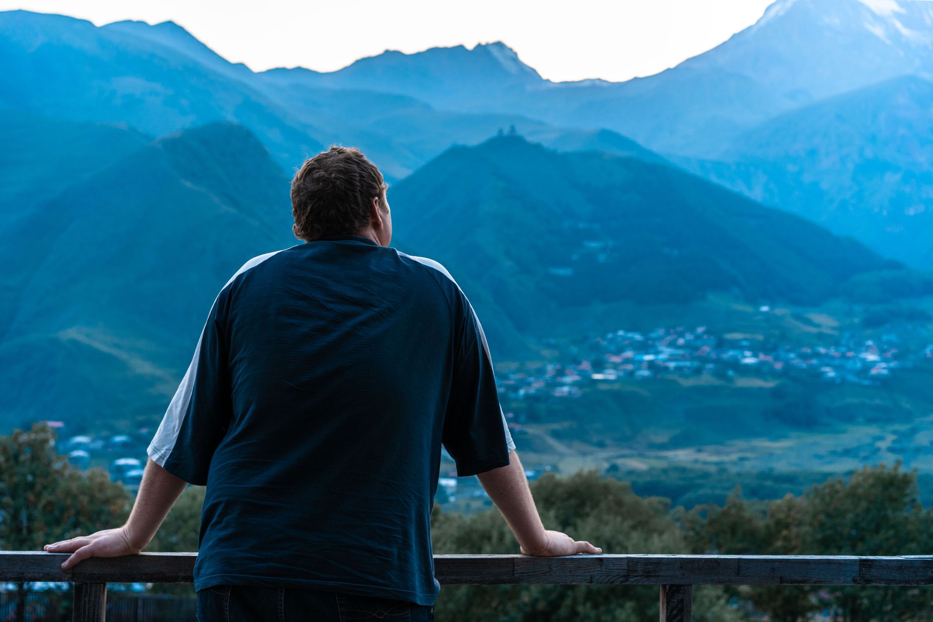 Photographer overlooking mountain horizon
